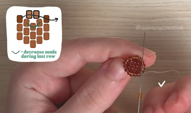 Adding light brown beads with a needle to the 3D beaded mini acorn after row 7, with an inset diagram showing the decrease made during the last row